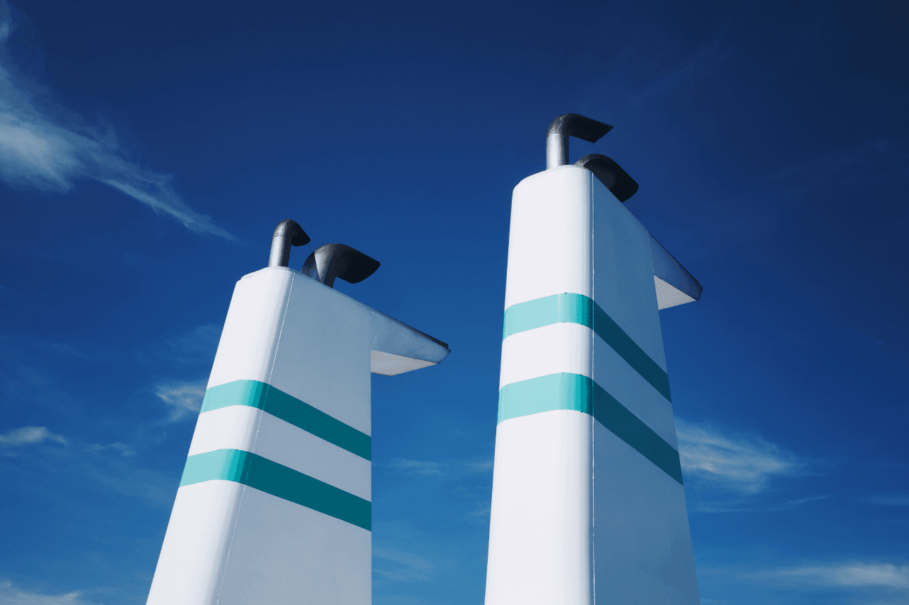 Ship exhaust stacks representing onboard emission monitoring